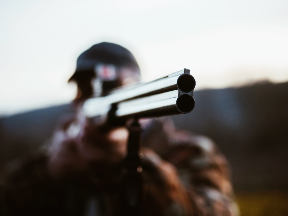 Close,Up,Of,Double,Barrel,Hunting,Gun.,Hunter,Man,Wearing