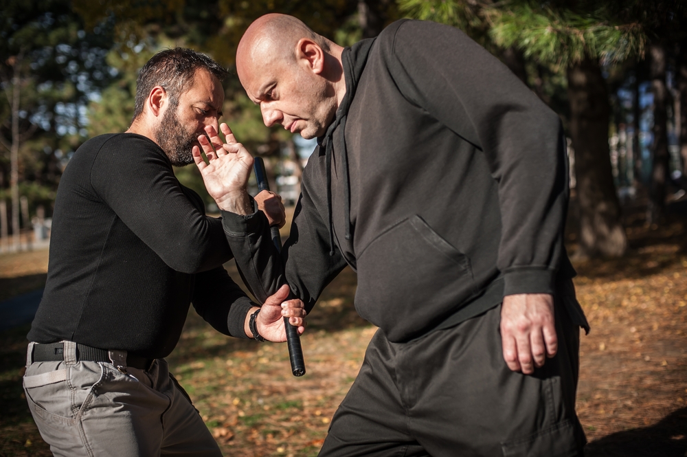 Police,Instructor,Demonstrates,Fighting,,Apprehension,And,Arrest,Techniques,Using,A