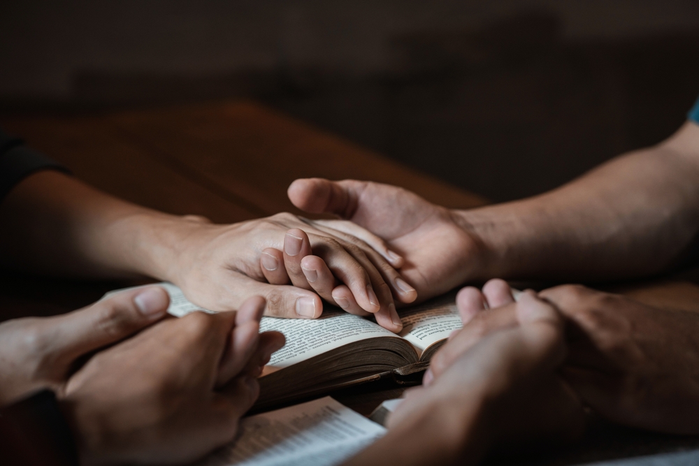 A,Group,Of,Young,Christians,Holding,Hands,In,Prayer,For