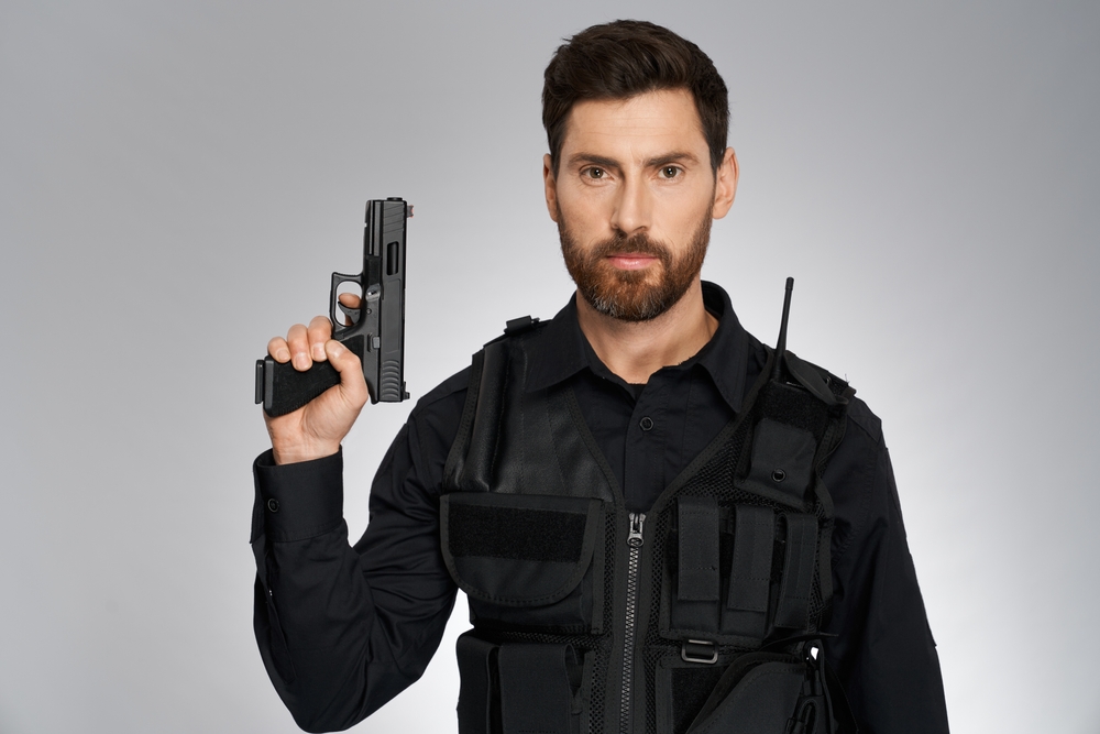 Handsome,Bearded,Cop,With,Handgun,,Posing,To,Camera.,Portrait,Of