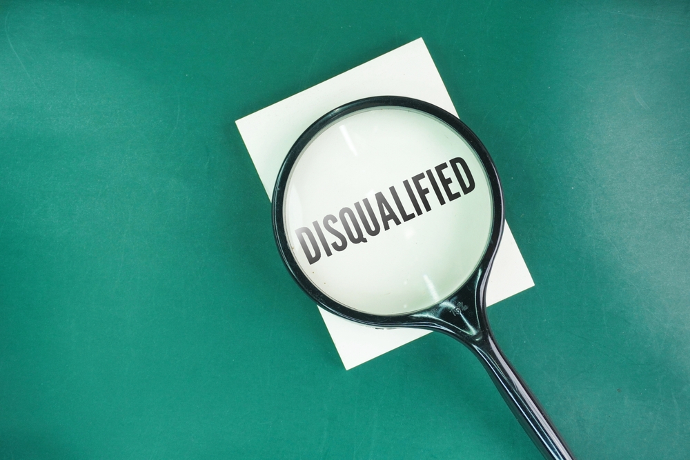 Magnifying,Glass,With,The,Word,Disqualified.,Concept,Of,Disqualification.,Declared
